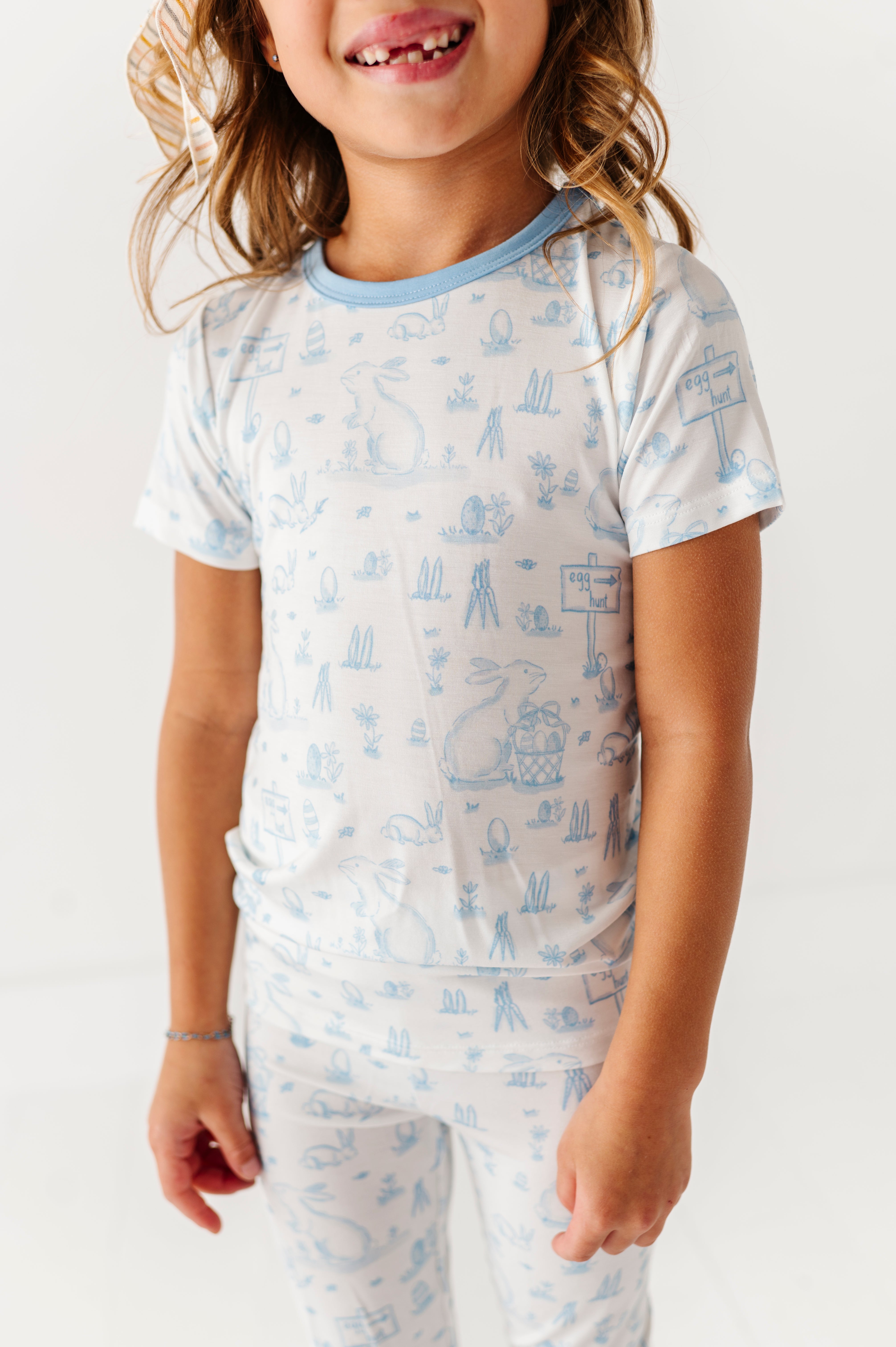 Child wearing a bamboo Easter pajama set on a plain background